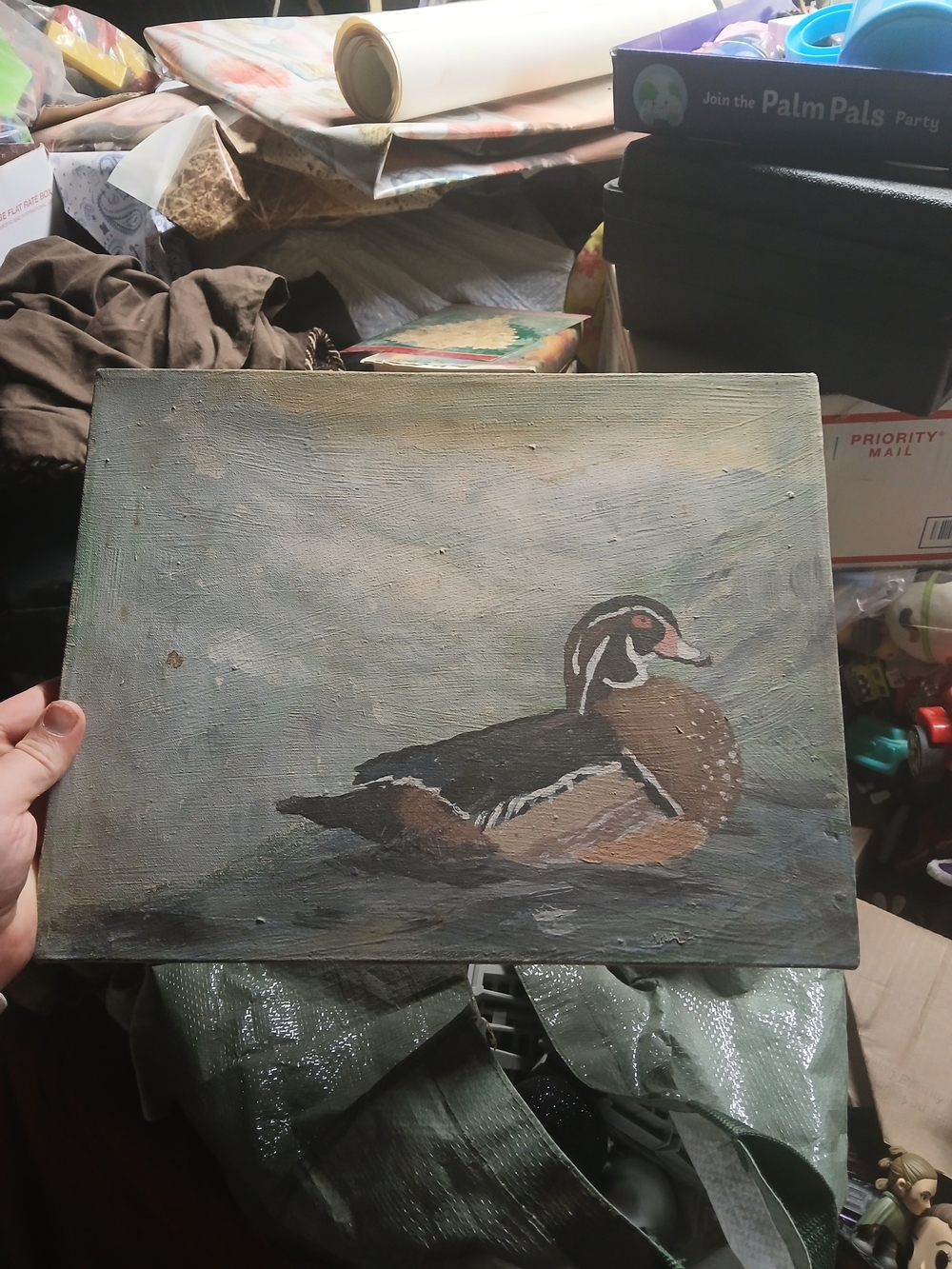 hand-painted artwork of a male wood duck resting on the water. 14"x11" Oil